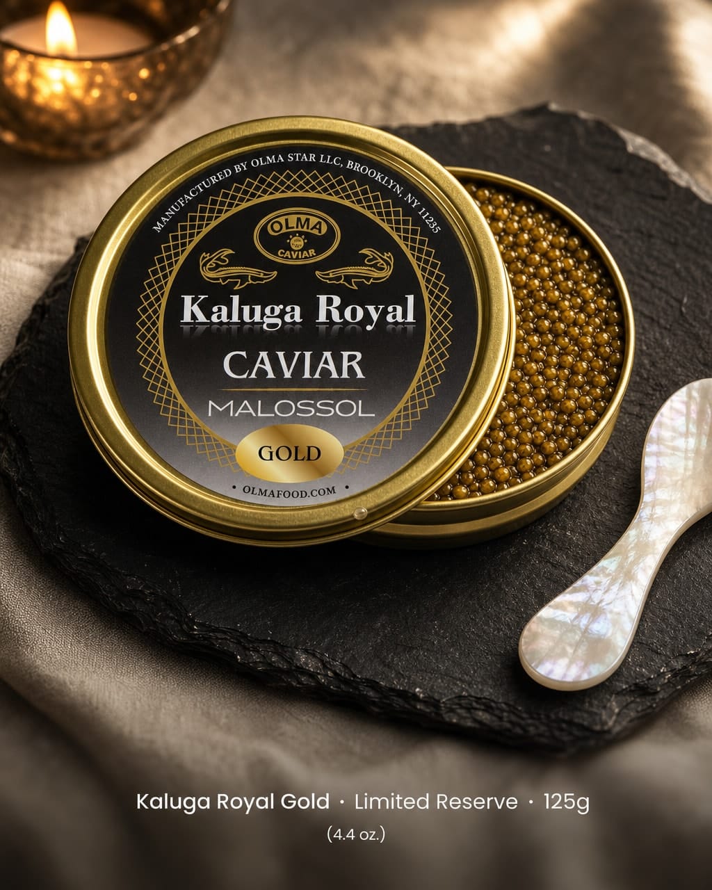 Tin of Kaluga Royal Gold caviar (Malossol), 125g, on a dark slate surface with a spoon nearby.